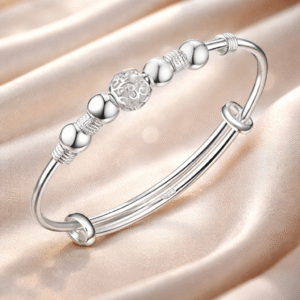 Brazalete rígido en plata de ley con detalles y esferas pulidas